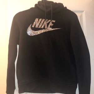 Black Nike hoodie with a cow neck.
